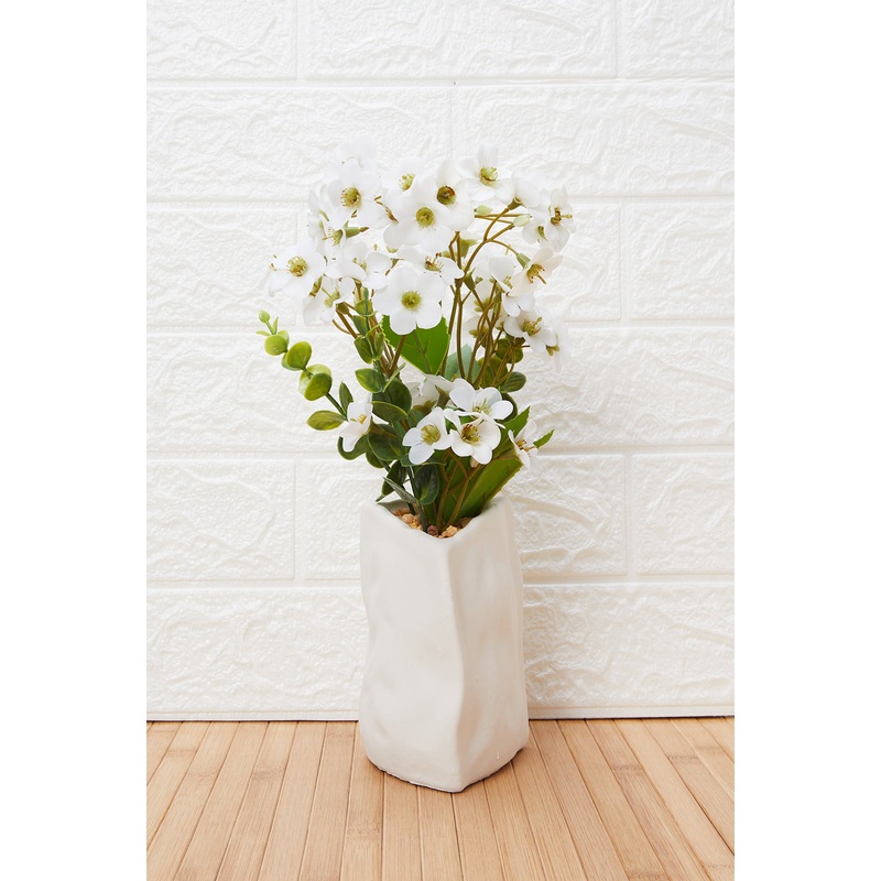 White Artificial Flower In Cement Pot